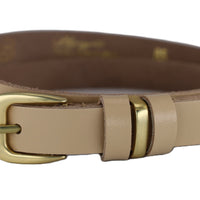 2cm brede taupe riem. Mat goud afgewerkt met 3 speelse lussen.