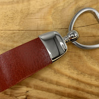 Rode sleutelhanger met hart vormige sleutelring.
