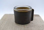 Kaarsenhouder voor theelicht. Glas en grof zwart leer