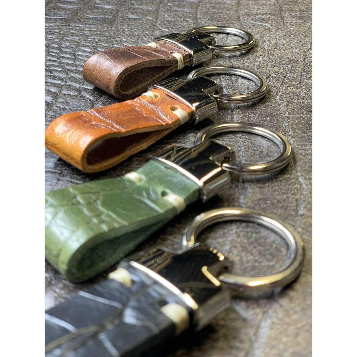 Groene luxe sleutelhanger met krokodillen print.