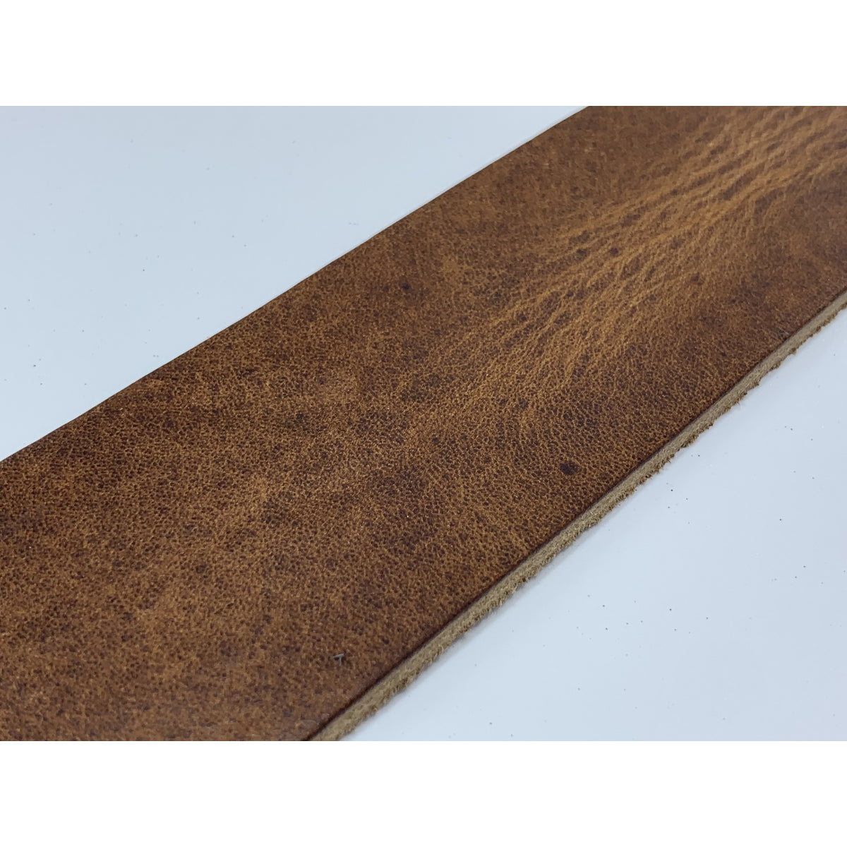 Zandkleurige 5cm brede riem. 