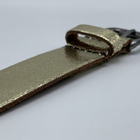 Goud kleurige riem van 3cm breed.