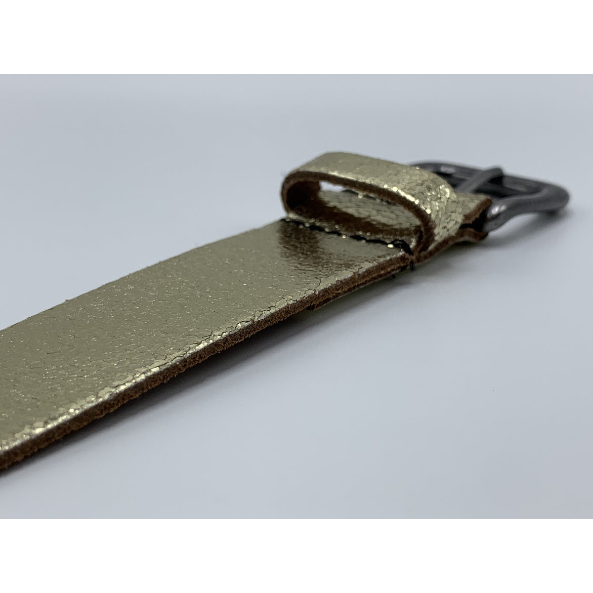 Goud kleurige riem van 3cm breed.