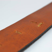Stoere cognac riem met gave details 
