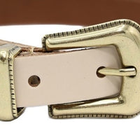 Beige smalle riem met western uitstraling. 