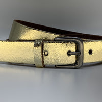 Goud kleurige riem van 3cm breed.