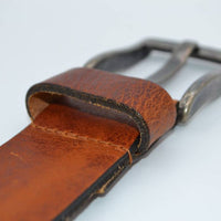 Stoere cognac riem met gave details 
