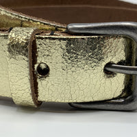 Goud kleurige riem van 3cm breed.