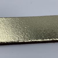 Goud kleurige riem van 3cm breed.