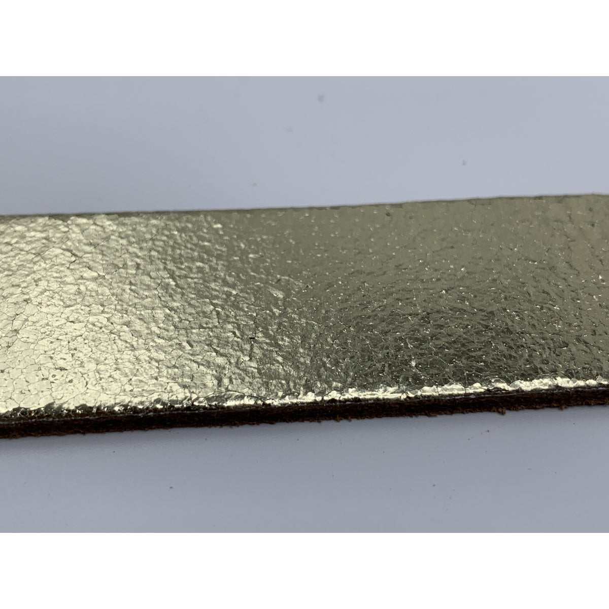 Goud kleurige riem van 3cm breed.