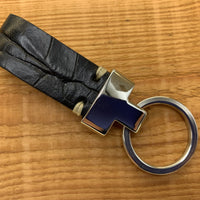 Zwarte luxe sleutelhanger met krokodillen print.