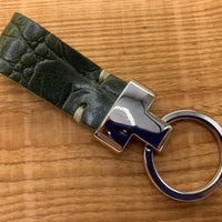 Groene luxe sleutelhanger met krokodillen print.
