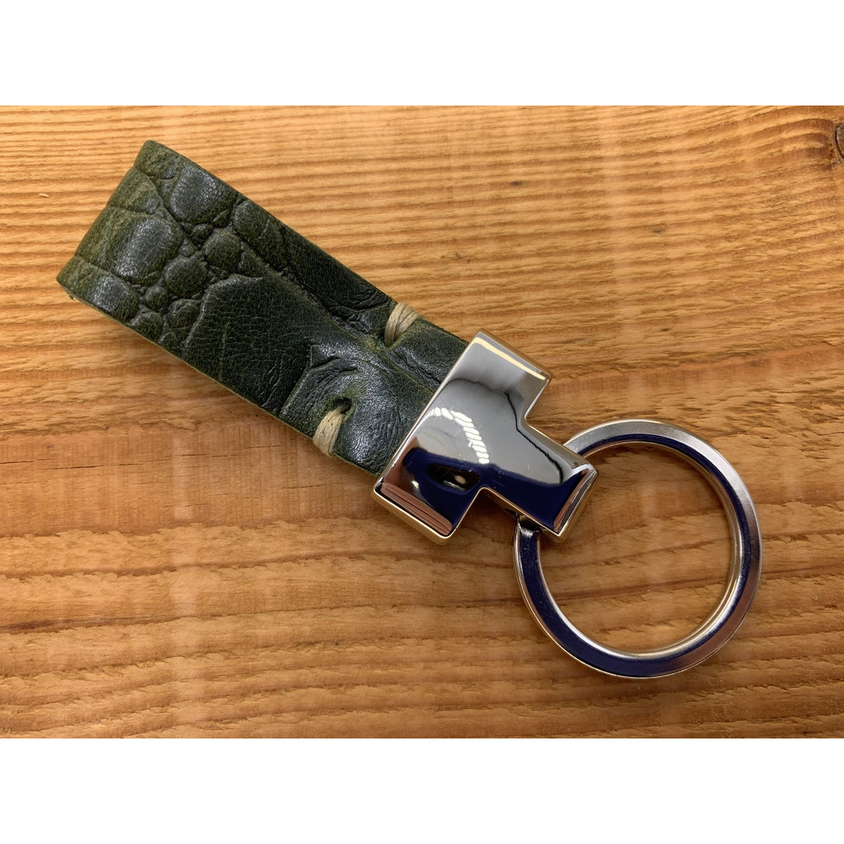 Groene luxe sleutelhanger met krokodillen print.