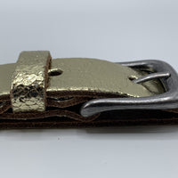 Goud kleurige riem van 3cm breed.