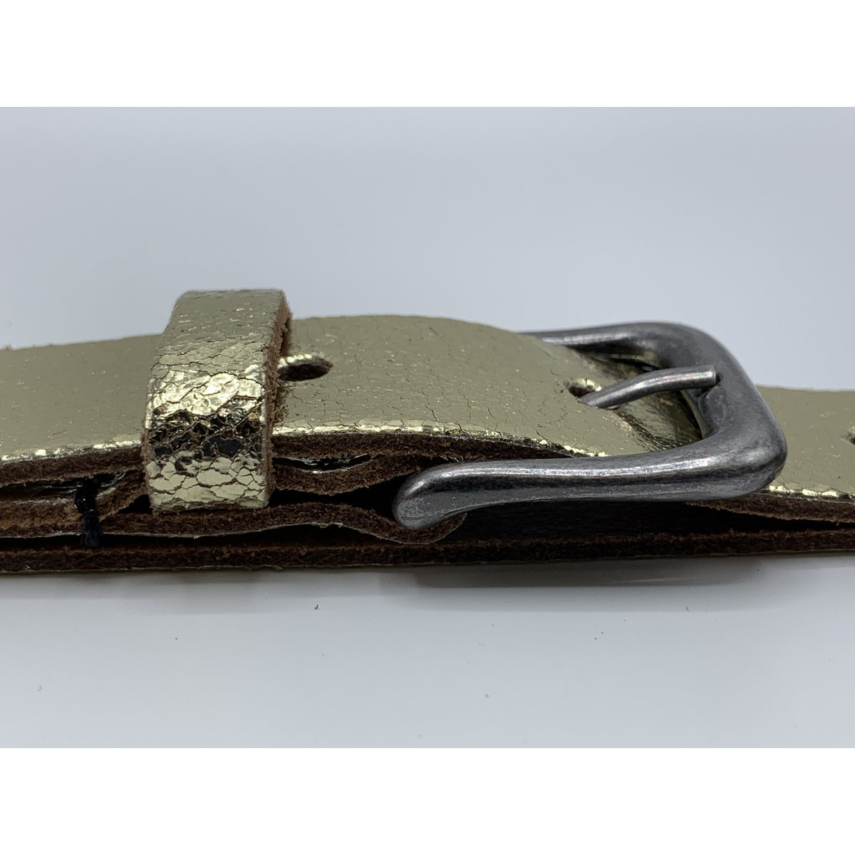 Goud kleurige riem van 3cm breed.
