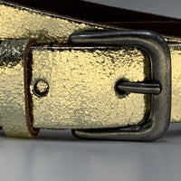Goud kleurige riem van 3cm breed.
