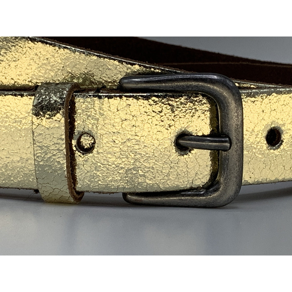 Goud kleurige riem van 3cm breed.