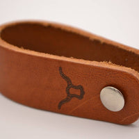 Leren sleutelhanger met logo